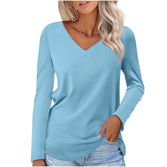 Timegard Women's Tops V-Neck Long Sleeve Basic Tee in a solid light blue color. This casual tunic top features a relaxed fit with clean lines and a simple silhouette, ideal for layering with cardigans or jackets. Made from soft, breathable fabric, it is suitable for spring, summer, and fall. Shown styled with light-wash denim jeans.