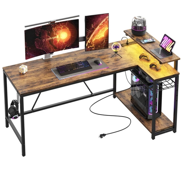 Bestier 58" Gaming Desk with LED Lights, an L-shaped corner desk in carbon fiber finish. Features a 6" monitor stand, adjustable shelves, and a spacious desktop measuring 58"L x 31.5"W. Includes 3 AC outlets, 2 USB ports, and RGB LED lights with 7 colors and 22 dynamic modes. Sturdy metal frame with adjustable leg pads for stability, ideal for gaming setups.
