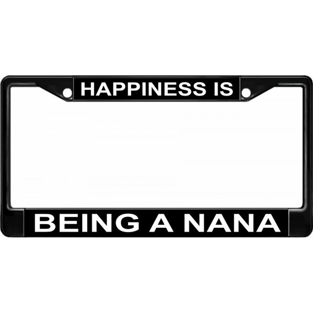 Happiness Is Being A Nana black license plate frame designed to fit standard 6" x 12" license plates. Made from durable black powder-coated material, it features two full-colour inserts with the text 'Happiness Is' on the top and 'Being A Nana' on the bottom in bold white lettering. The frame includes pre-drilled holes on the top for easy mounting on vehicles.
