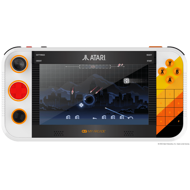 MyArcade - Gamestation Go, Portable Video Game System with a 7-inch full-color display showing an Atari game set against a dark cityscape and mountains. The white handheld console features orange and red accents, dual joysticks, a red D-pad, orange Y, X, B, A buttons, and a numeric keypad. It supports Wi-Fi updates and has a built-in rechargeable battery, ideal for portable retro handheld gaming.