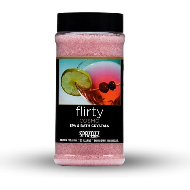Spazazz Aromatherapy Spa and Bath Crystals - Cosmo 17oz, a container of pink bath salts with a black lid. The label features a cocktail image with lime and cherries, highlighting its fruity and flirty aroma. These aromatherapy crystals are made with all-natural ingredients, gentle on skin, spa filter safe, oil-free, and leave no residue. Perfect for relaxing baths or hot tubs while nourishing the skin.