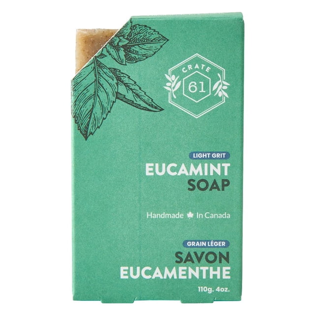 Cool Mint Natural Bar Soap | 110g by Crate 61 Organics Inc, showing a rectangular bar partially wrapped in green packaging with black leaf illustrations and white text stating 'Eucamint Soap' and 'Handmade in Canada', featuring a light grit texture and natural bath soap qualities suitable for refreshing body care.