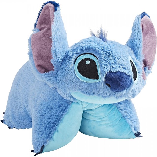 Stitch Pillow Pet - Disney Lilo and Stitch Stuffed Animal Plush Toy featuring a soft, multicolour design of the blue Stitch character. Made from a cotton/poly blend, this officially licensed plush toy doubles as a pillow and is ideal for cuddling or display.
