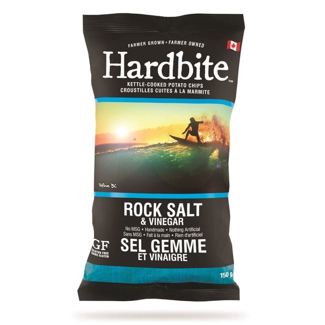 Hardbite Chips Hardbite Rock Salt And Vinegar Kettle Cooked Potato Chips 150 g bag with black packaging featuring a sunset surfing scene in Tofino, BC. The gluten-free, handmade chips contain no MSG or artificial ingredients, labelled in English and French.