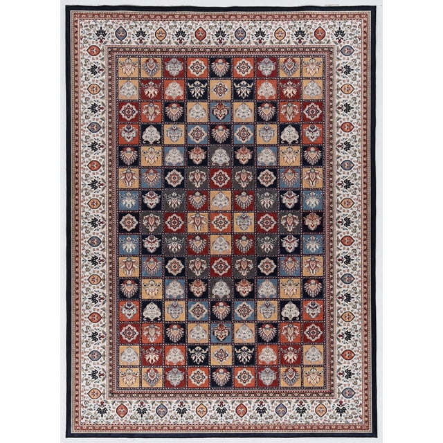Emerald Martin Blue & Navy 6'7" x 9'7" area rug with low pile and detailed traditional multicolored square pattern in jewel tones of blue, navy, red, and gold, bordered by a cream floral band with serged edges, made from easy-care polyester with a slight sheen and rubber-backed felt for grip, ideal for larger rooms or open spaces and suitable as a decorative accent rug.