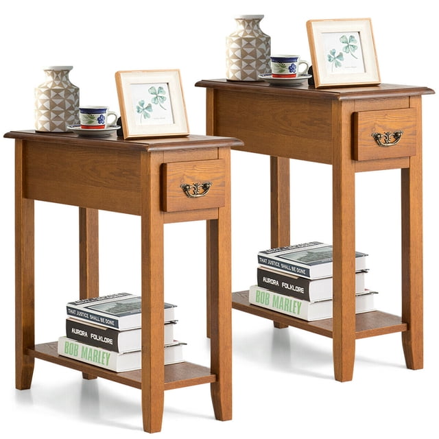 Gymax Set of 2 End Table Bedside Sofa End Table Narrow Nightstand in yellow finish, featuring a compact design with a spacious tabletop, a single drawer with a decorative handle, and a lower open shelf for storage. Made of MDF and rubber wood, each table measures 24 inches in height, 10 inches in width, and 24 inches in length. Suitable for narrow spaces like beside a sofa or bed, these tables are ideal for bedrooms or living rooms. The set is shown with decorative items and books for display.