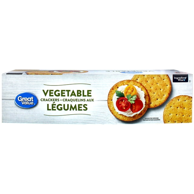Great Value Vegetable Crackers box with a white wood-textured background featuring round wheat crackers, one topped with cream cheese, cherry tomato slices, and parsley, highlighting low saturated fat, trans fat free, and ideal for snacking or party platters.