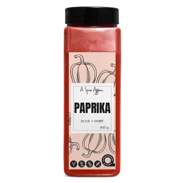 Paprika Sweet 450g (15.9 oz) A Spice Affair Large Shaker featuring a crimson-red spice in a tall shaker with a black lid. The label displays hand-drawn paprika illustrations and text indicating 'Sweet' and '450g.' Ideal for versatile cooking, categorized under single herbs and spices, and sourced from Spain.