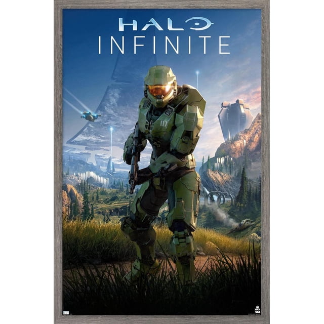 Halo Infinite - Primary Vertical Wall Poster, 22.375" x 34" featuring a framed vertical wall art poster with a green-armored soldier holding a rifle in a grassy field, set against a detailed sci-fi mountainous landscape with futuristic buildings and flying vehicles under a blue sky, suitable for room decor or gifting.