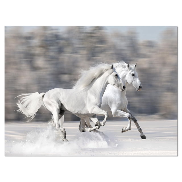 Designart Two White Horse Canvas Wall Art featuring two white horses running through snow with blurred forest background, printed on premium cotton canvas with fade-resistant ink and gallery-wrapped edges, ready to hang and ideal for adding country charm to home décor.