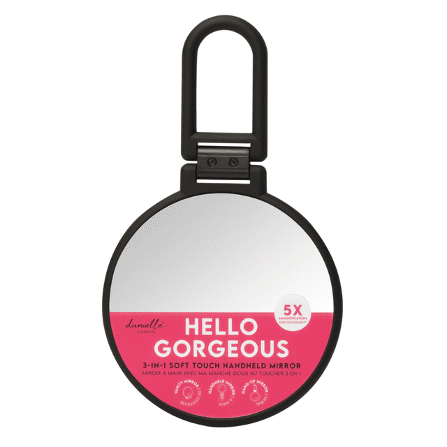 Danielle 5x Soft Touch Handheld Makeup Mirror, Black, front view of a round cosmetic mirror with a matte black soft touch frame, featuring 5x magnification and a pink label reading 'Hello Gorgeous' and '3-in-1 soft touch handheld mirror', ideal for detailed makeup application and vanity accessory, also suitable for on-the-go use.