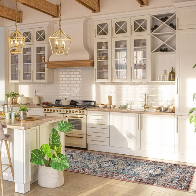 ECARPET traditional vintage style Bolivia Bijar collection area rug featuring intricate blue, beige, and red patterns on the floor of a modern kitchen with white cabinetry and wood details.