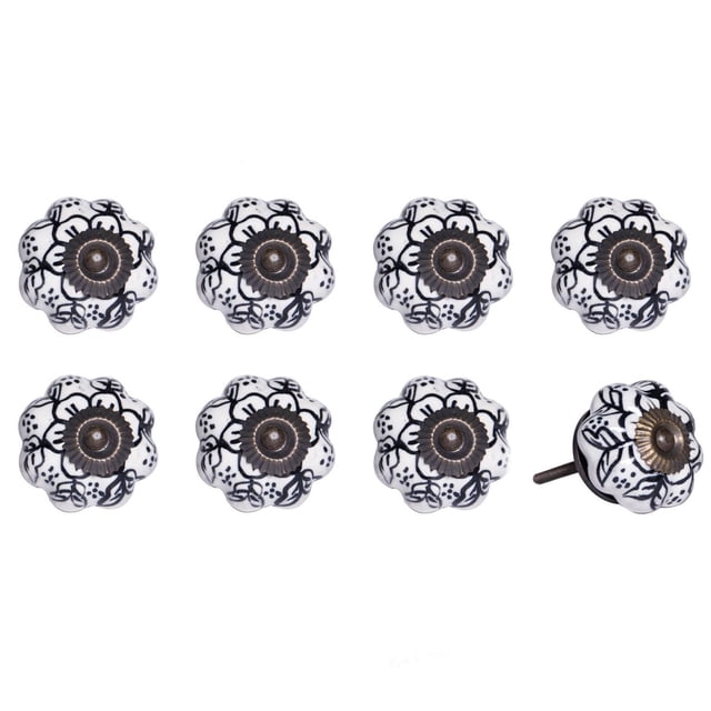 KNOB-IT vintage handpainted ceramic knobs 8 pack featuring white flower-shaped knobs with black floral patterns and antique bronze metal centers, each 1.5 inch diameter with 1.25 inch bolts that can be trimmed, suitable for cabinets and drawers, one knob shown side view displaying bolt.
