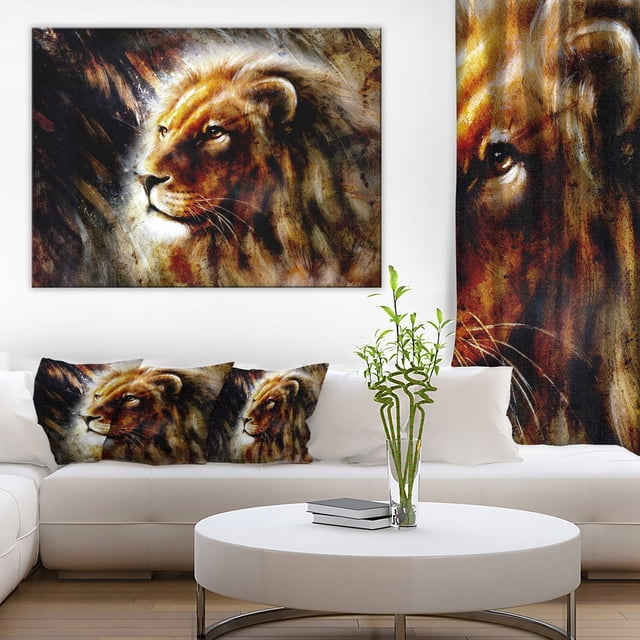 Dymo Design Art Majestically Peaceful Lion Canvas Print on gallery-wrapped cotton canvas showing a detailed lion profile in warm brown and gold tones, displayed above a white sectional sofa with matching lion-themed pillows, alongside a round white coffee table with a glass vase holding green bamboo, suitable for adding wildlife-inspired décor to living spaces.