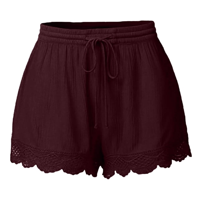 Timegard Plus Size Shorts for Women featuring a wide-leg design, elastic waistband with drawstring, and lace ruffle hem in a solid color. Made from a lightweight blend of 95% polyester and 5% spandex, these casual shorts are breathable and soft, ideal for spring and summer wear. The shorts are shown in a front-facing view, highlighting their relaxed fit and intricate lace detailing at the hem.