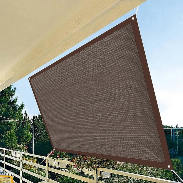 Dvkptbk Voile d'Ombrage, Pare-Soleil Extérieur Rectangulaire Couleur Café en Tissu Polyéthylène Haute Densité 185 G/m2. Il Est Exposé sur un patio, Offrant une protection Solaire de 95 % et un design Respirant pour la Circulation d'Air. la Voile d'Ombrage Comprend des Bords Renforcés et des Anneaux d'Angle en Acier Inoxydable pour une installation Sécuritaire.