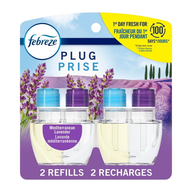 Febreze Plug In Air Freshener Mediterranean Lavender scented oil refill pack with two clear plastic bottles with blue and purple caps, designed for automatic odor-fighting scent release lasting 50 days per refill, shown with lavender field background.