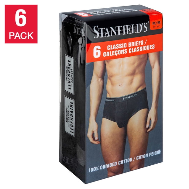 Stanfield’s Men’s Briefs, 6-pack in black, medium size, displayed in retail packaging. The box highlights features such as 100% combed cotton, a supportive pouch with a full fly opening, and a plush-back signature waistband for comfort. The packaging shows a model wearing the briefs and includes bilingual text, emphasizing the classic design and comfort.