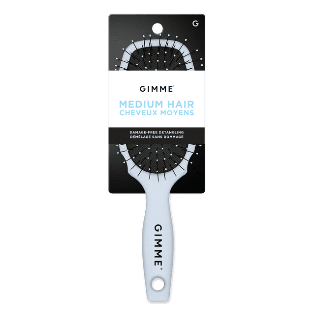Gimme Medium Hair Detangling Brush in blue with a rectangular paddle head featuring black flexible synthetic bristles tipped with white beads on a textured black cushion, and a blue ergonomic handle with a hanging hole and GIMME branding, designed for gentle, damage-free detangling of medium hair and suitable for use on wet or dry hair.