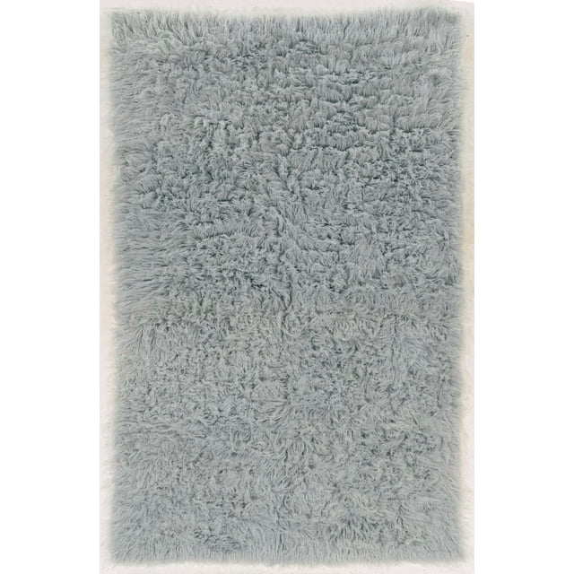 New Flokati 1400gr 8' x 10' area rug in light grey, hand woven in Greece from 100% New Zealand wool with a deep plush shag pile, shown from above emphasizing its thick, soft texture, ideal for adding warmth and comfort to living rooms or bedrooms and often used as a cozy floor accent.