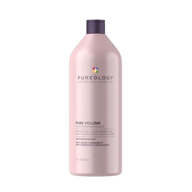 Pureology Pure Volume Conditioner 1 L in a sleek, pastel pink bottle with a purple cap. Designed for fine, colour-treated hair, this lightweight conditioner adds volume, moisturizes, detangles, and protects hair while enhancing colour brilliance. Features Pureology's AntiFade Complex and 100% vegan ingredients.