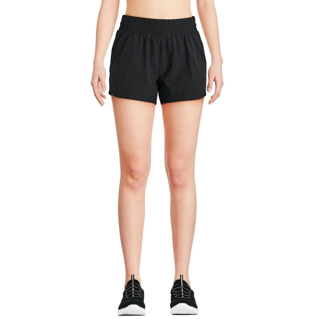 Athletic Works Short Tissé pour Femme en Noir Montré à l'Avant sur un Modèle, Doté d'Une Taille Élastiquée et d'Une Coupe Décontractée en Tissu Tissé Extensible, Convient aux Vêtements de Sport et Bas Athlétiques pour Femmes pendant les Entraînements Ou les Tenues Décontractées.