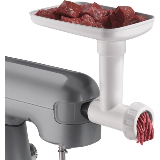 Cuisinart Plastic Precision Master Meat Grinder Attachment with Sausage Stuffer Kit connected to a gray Precision Master stand mixer, showing raw red meat chunks in the white plastic tray and ground meat extruding from the front, suitable for food prep and kitchen appliance accessory use.