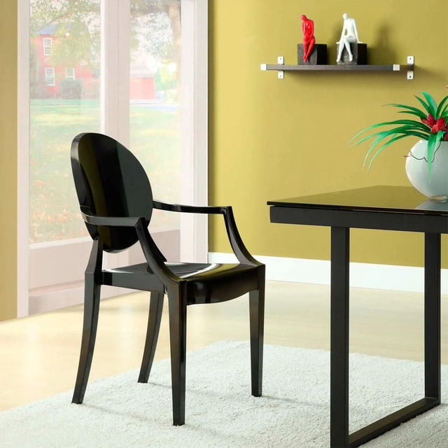Heavenly Collection Plastic Arm Chair in black polycarbonate with King Louis back design, featuring a glossy finish and sleek armrests, positioned on a light rug beside a black table in a modern living room, ideal for accent seating.