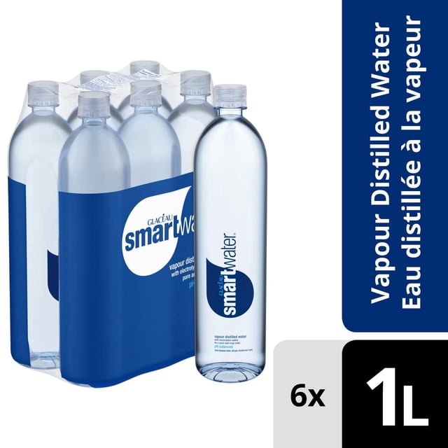 Glaceau Smartwater Bottle, 1 Liter, 6 Pack featuring six clear plastic bottles with blue smartwater labels, vapor distilled and pH balanced water with added electrolytes, packaged in a shrink-wrapped multi-pack ideal for hydration at home or on the go.