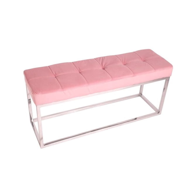 Banc rembourré en velours vert avec base en acier inoxydable.