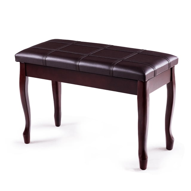 Costway Solid Wood PU Leather Piano Bench Padded Double Duet Keyboard Seat Storage in brown. The bench features a sturdy solid wood frame with a padded PU leather seat, designed to accommodate two people. It includes a spacious storage compartment beneath the seat for sheet music and books. The bench has anti-slip feet pads to protect floors and a noise-reduction pad for quiet lid closure. Its elegant design and lightweight construction make it suitable for orchestras, recording studios, and concerts.