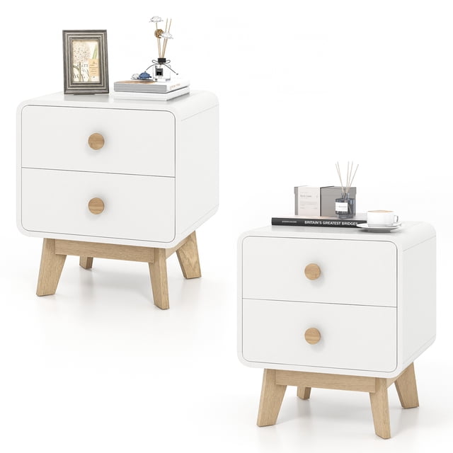 Costway 2 PCS Nightstand Mid Century Modern Bedside Table with 2 Drawers in white, featuring a sleek design with solid rubber wood legs and rounded edges. Each nightstand includes two spacious drawers with convenient handles and a waterproof surface for easy cleaning. The raised support feet with non-slip foot pads ensure stability and safety. Suitable for bedrooms, living rooms, or studies, these nightstands measure 18.5 inches long, 16 inches wide, and 21.5 inches high.