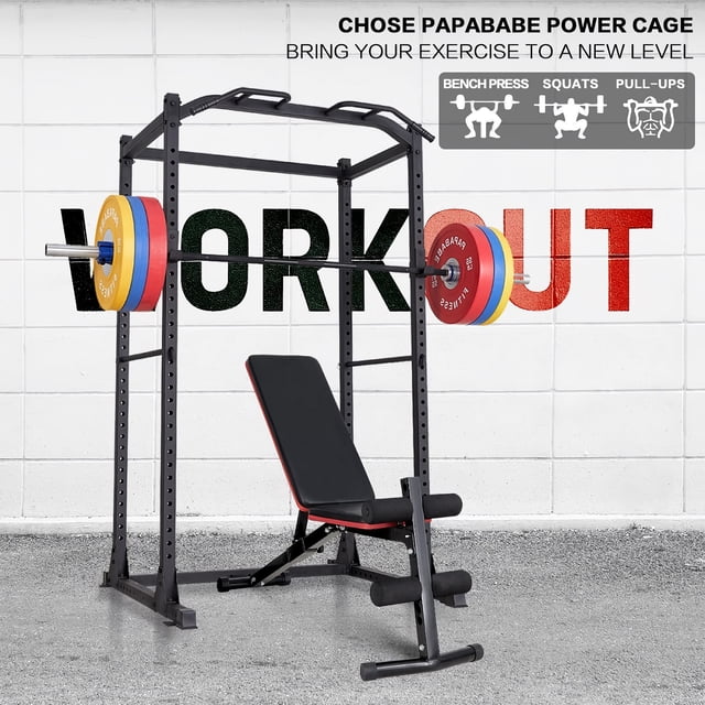 Power Cage, Multifunctional 1200lb Capacity Squat Rack with 2 Extra J-Hooks for Squats, Bench Press, Pull Ups, Strength Training, Home, Gym - 1026785. A black alloy steel squat rack with a heavy-duty 2" x 2" tubular steel frame, adjustable J-hooks, and 25.5" safety bars. The rack is shown with a barbell and weight plates, alongside a bench, in a gym setting with a concrete floor and a white wall featuring the word 'WORKOUT' in bold letters.