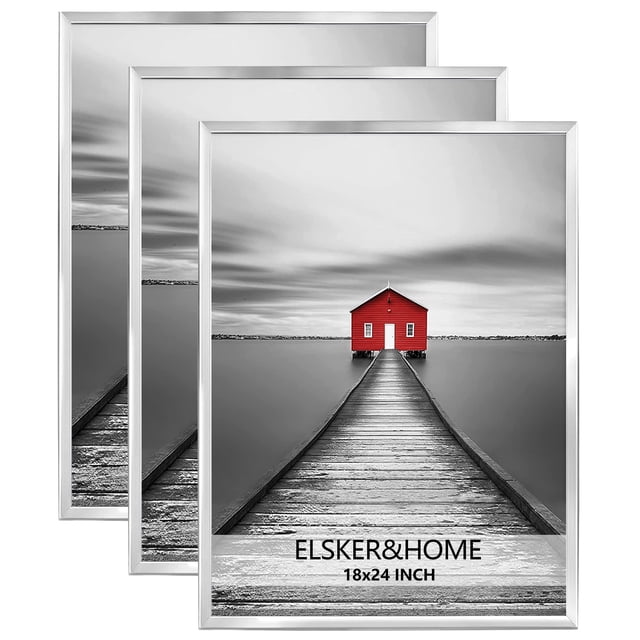 ELSKER&HOME 18x24 poster frame 3 pack in silver, featuring a modern and aesthetic design. Each frame is lightweight with durable MDF backboards and can be mounted horizontally or vertically on walls. The set is ideal for displaying posters, photos, or prints in homes, offices, or galleries. The frames are shown with a red house print against a black-and-white background.