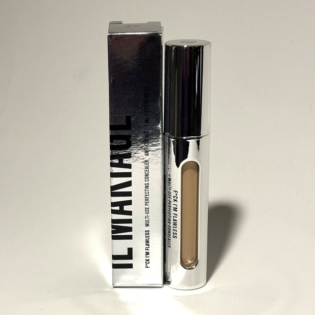 IL Makiage F*ck I'm Flawless Multi-Use Perfecting Concealer in Shade 08, shown with its sleek silver packaging and transparent tube displaying the product's creamy formula. This vegan, cruelty-free, oil-free, and paraben-free concealer offers long-lasting coverage for under-eye circles, blemishes, dark spots, and hyperpigmentation. Ideal for versatile use as a concealer, contour, or highlighter.