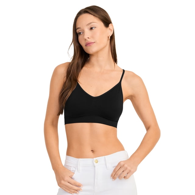 Jockey Soutien-Gorge Léger à Bretelles Cami Extensible Sans Coutures pour Femme en Noir, avec un design Sans Coutures pour une Sensation « Presque Rien ». Fabriquée à Partir de 92 % nylon et 8 % Élasthanne, Offre une Coupe Soyeuse, Respirante et Extensible Qui Bouge avec Votre Corps. Bretelles Ajustables Offrent un Ajustement Personnalisable. Montré sur un Modèle Assorti à un Pantalon Blanc.