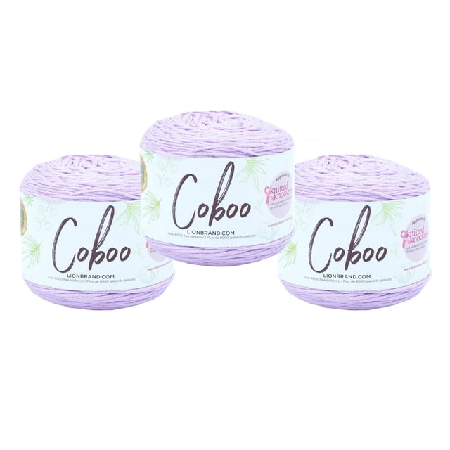 Lion Brand Coboo Yarn in light purple, three skeins with white labels featuring green botanical designs and the Coboo logo, made of 51% cotton and 49% bamboo, ideal for year-round garments, shawls, and home décor, also suitable for crafting accessories.