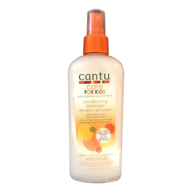 Cantu Kids Detangling Conditioner in a white plastic bottle with an orange spray pump, softening strands for easy-comb curls, infused with shea butter, coconut oil, and honey, free from sulfates, silicones, parabens, and mineral oil, ideal for gentle care of textured hair.