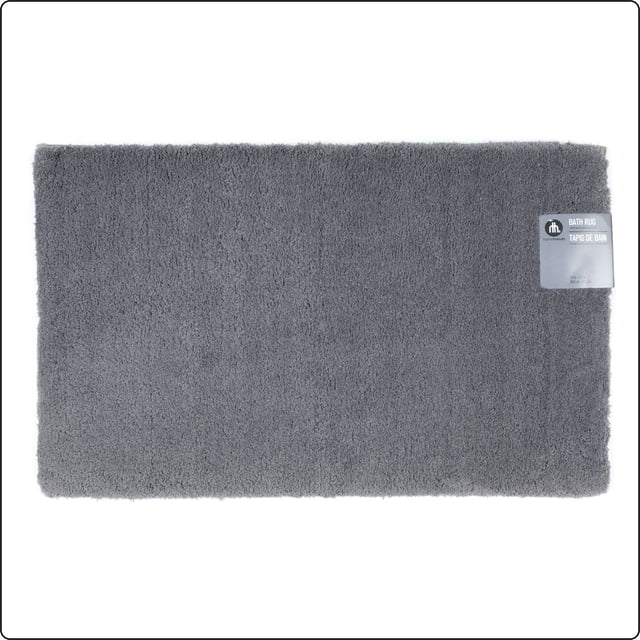 Hometrends Tapis de Bain en Polyester Gris Foncé Uni 3K avec Fibres de Polyester Gris Foncé Moelleuses et Forme Rectangulaire, avec une Étiquette en Haut à Droite, Conçu pour une Utilisation dans la Salle de Bain avec Endos Absorbant et Antidérapant, Idéal pour les Salles de Bain des Maîtres Ou des Invités.