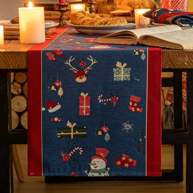 Christmas Table Runner by Mas Decor, 72 inches long, featuring a festive design with snowmen, reindeer, gifts, and candy canes on a blue background with red borders. Made of 100% polyester, it is durable, easy to maintain, and suitable for indoor and outdoor use. Ideal for dining tables, coffee tables, and holiday gatherings, accommodating 4-6 people. Perfect for enhancing the Christmas atmosphere with rustic and elegant charm.