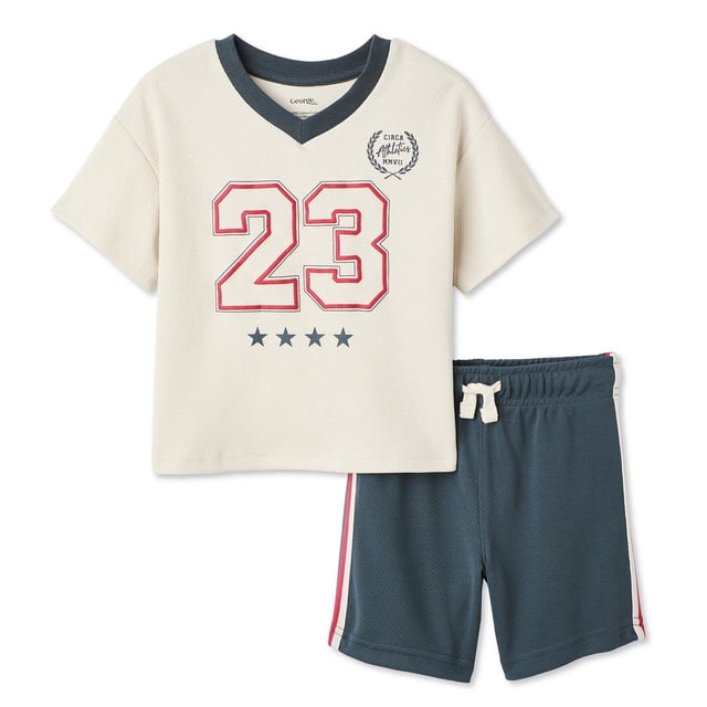 George toddler boys' short-sleeve athletic set with a cream V-neck top featuring a red and navy number 23 graphic and four navy stars, paired with navy elastic waist shorts with red and white side stripes and a cream drawstring, ideal for casual play.