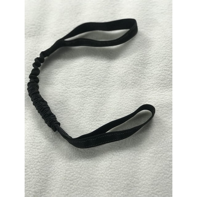 Cool Runners Dog Tug Bungee in black nylon with soft-touch shock cord, featuring two loop handles and a 22-inch cord extending to 32 inches, designed to absorb shock for comfortable tugging and suitable for fetch play when a toy is added, displayed on a white textured surface.