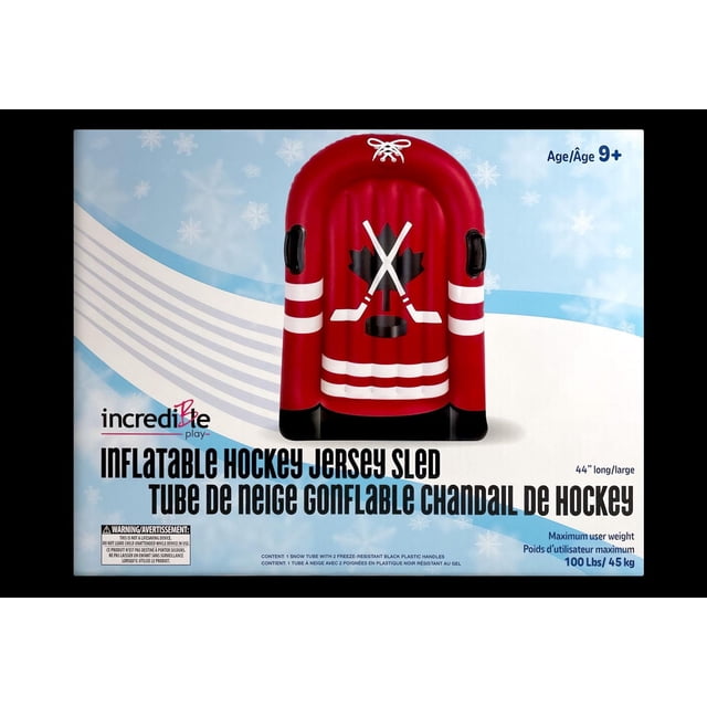INCREDIBLE NOVELTIES HOCKEY SNOW SLED inflatable red sled shaped like a hockey jersey with white stripes and black base, featuring two black freeze-resistant handles, crossed hockey sticks and puck graphic, 44 inches long, designed for ages 9 and up, supports up to 100 lbs (45 kg).
