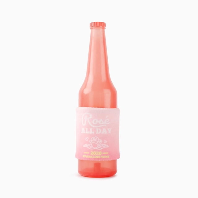 Hugsmart Rose Dog TPR Rubber Toy shaped like a pink sparkling wine bottle with a pink plush sleeve labeled 'Rosé All Day 2020 Sparkling Wine', featuring a squeaky rubber core for chewing and mental stimulation, suitable for gentle chewers.