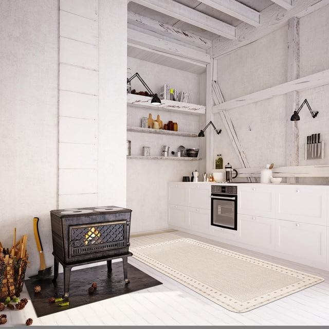 ECARPET Kitchen, Hallway, Laundry Room, Entrance, Kids Room, Bathroom Mat & Utility Rug with non-slip rubber backing in a rustic white kitchen with wooden floors, black cast iron wood stove on a hearth mat, white cabinetry with built-in oven, open shelves with kitchenware, and black adjustable wall lamps. The beige jute-style rug features a geometric border and is durable, easy to clean, and ideal for high-traffic areas.