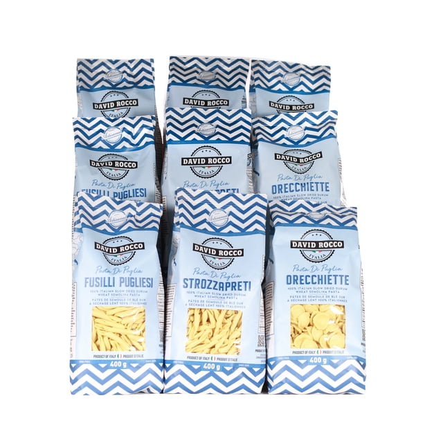 David Rocco 9pc Pasta Bundle featuring nine 400g bags of authentic Italian dry pasta, including Strozzapreti, Orecchiette, and Fusilli Pugliesi. Packaged in blue and white chevron-patterned bags with clear branding and product details. Ideal for pantry storage and shipped in a secure corrugated box.