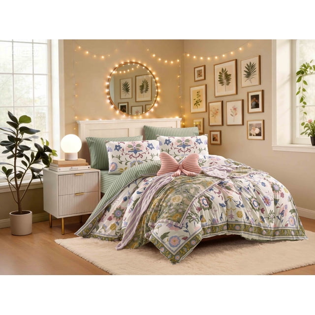 Mainstays DQ Izzy Medallion Duvet Set, 3-Piece, Multi, Adult — front-facing view of a Double/Queen duvet cover showing a large-scale bohemian botanical medallion print in indigo blue, plum, sage green and marigold on a cream field with a framed perimeter border; a folded corner reveals the reversible green stripe pattern; two matching standard pillow shams visible; woven 100% cotton texture and stitched edges evident; also suitable as a decorative bed-layering piece.