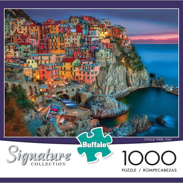 Buffalo Games Signature Collection Cinque Terre 1000 Piece Jigsaw Puzzle depicting a colorful coastal village with stacked houses on rocky cliffs by the sea at sunset, finished size 26.75 by 19.75 inches, includes a bonus poster, made in the USA from recycled materials, suitable for ages 12 and up, often used as a relaxing pastime for puzzle enthusiasts.
