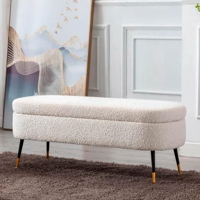 Heavenly Collection Storage Bench with off-white modern bouclé upholstery and hidden storage under the cushioned seat. It has slim black metal legs with gold tips, measuring 19.25 inches high by 48 inches wide, suitable for entryway seating and storage.