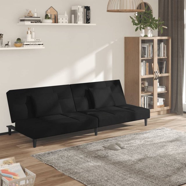 vidaXL 2-Seater Sofa Bed with Two Pillows in black velvet, displayed in a modern living room. This versatile sofa converts into a twin bed with adjustable backrests, ideal for guest accommodations or home theater seating. It features a sturdy wooden frame, foam filling, and plastic feet for stability and comfort. Includes two matching pillows, suitable for small spaces like apartments or studios.